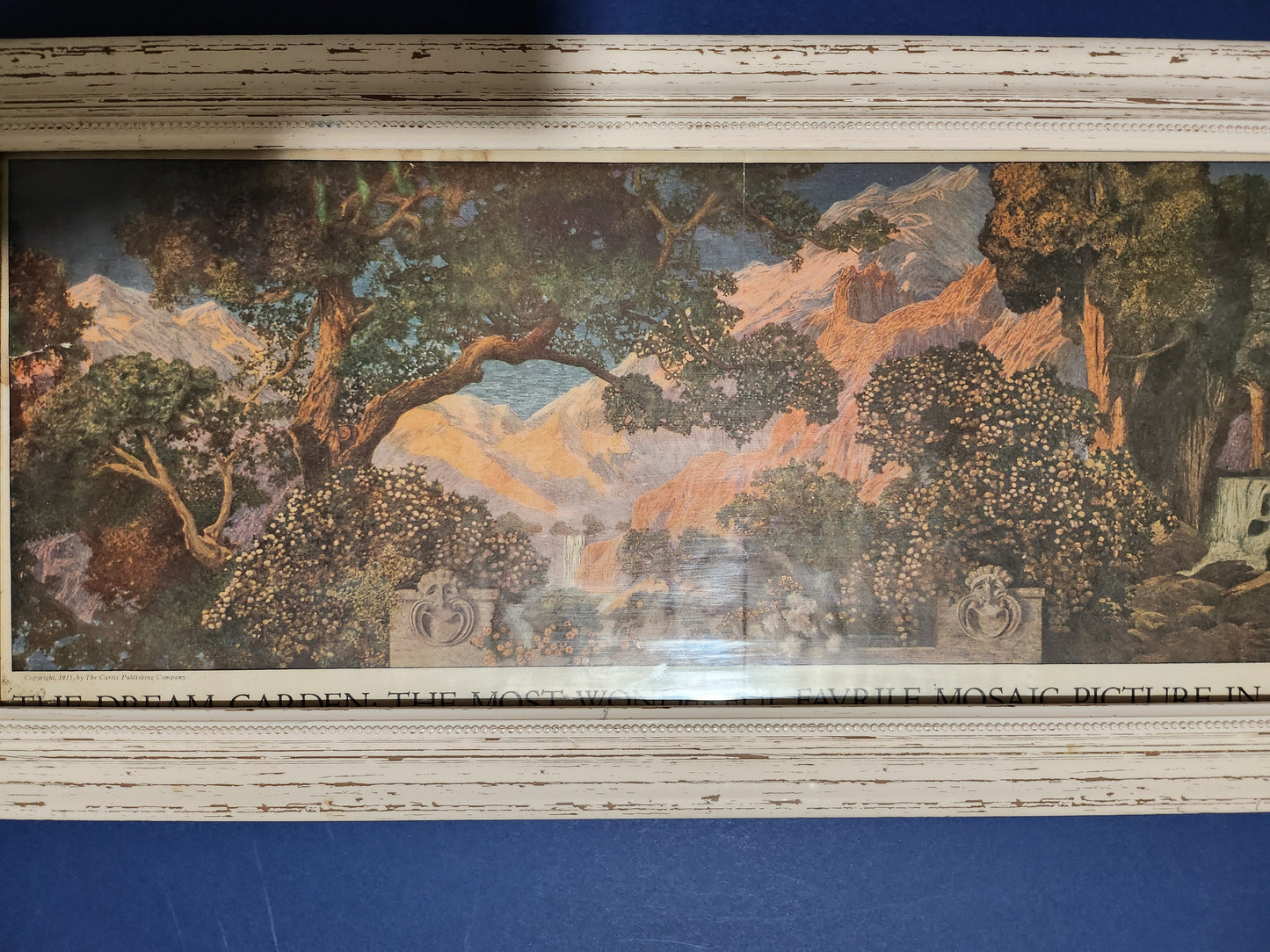 Close-up image of Maxfield Parrish's 'Dream Garden' - featuring a depiction of the garden at his estate with Mount Ascutney in the background