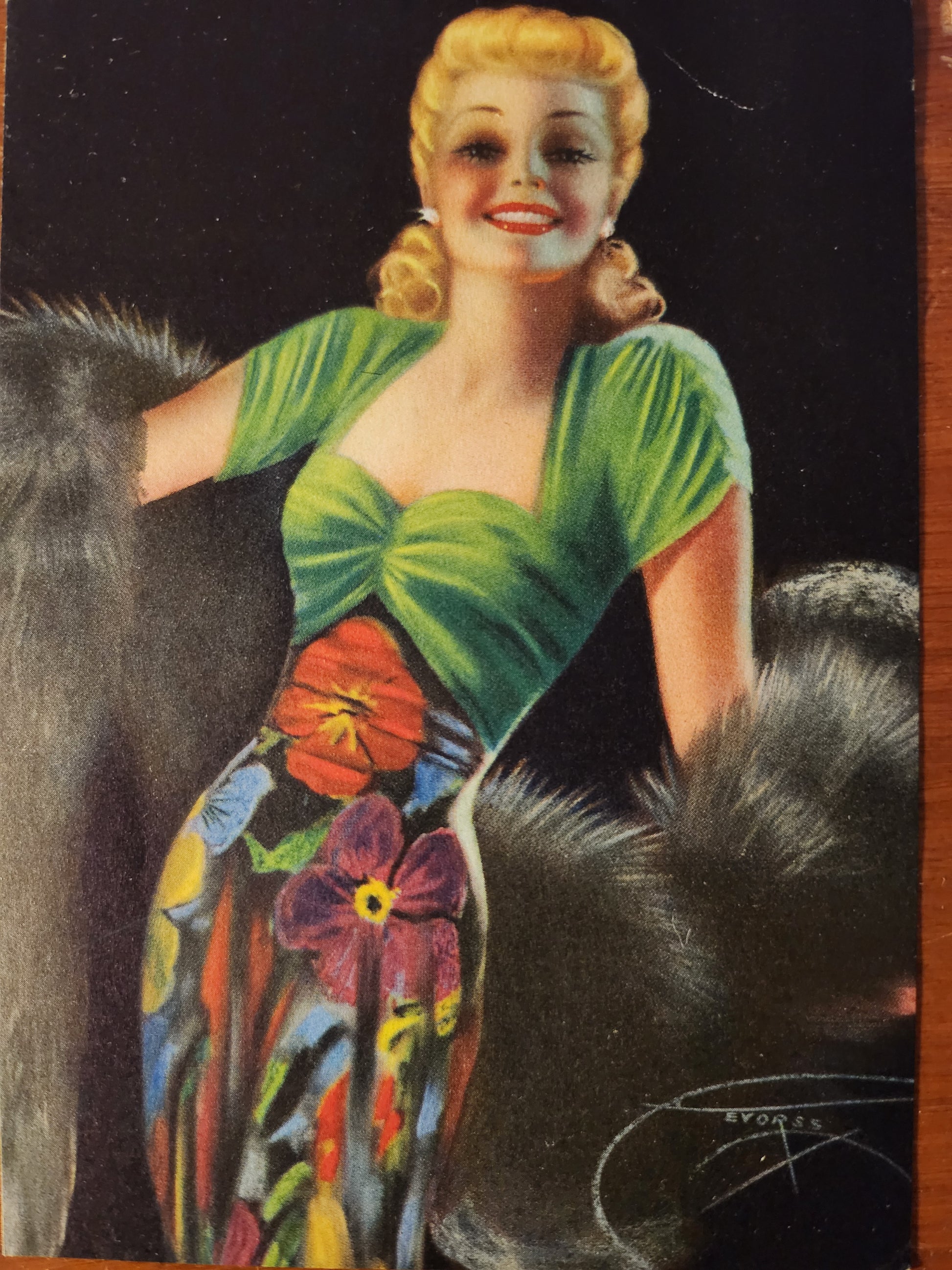 Vintage, pin-up model illustration of a woman in a green dress with floral patterns and a fur wrap