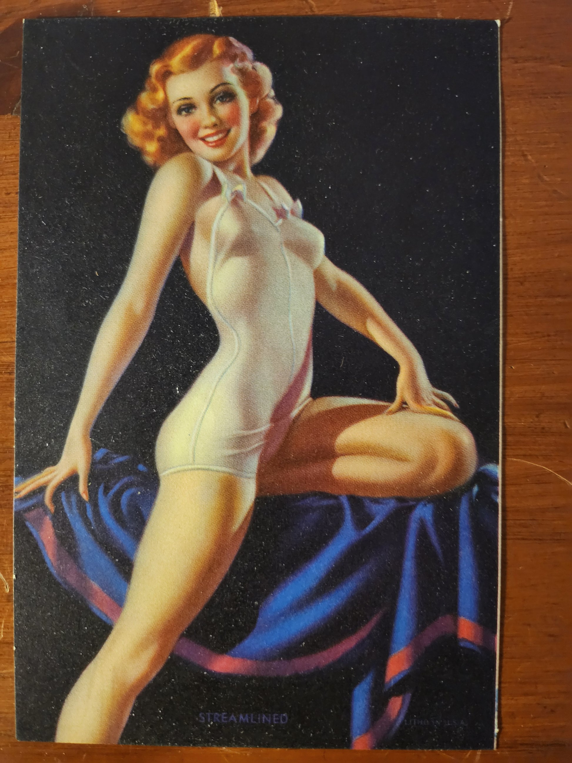 Vintage pin-up model illustration of a woman in a white swimsuit on a dark background 