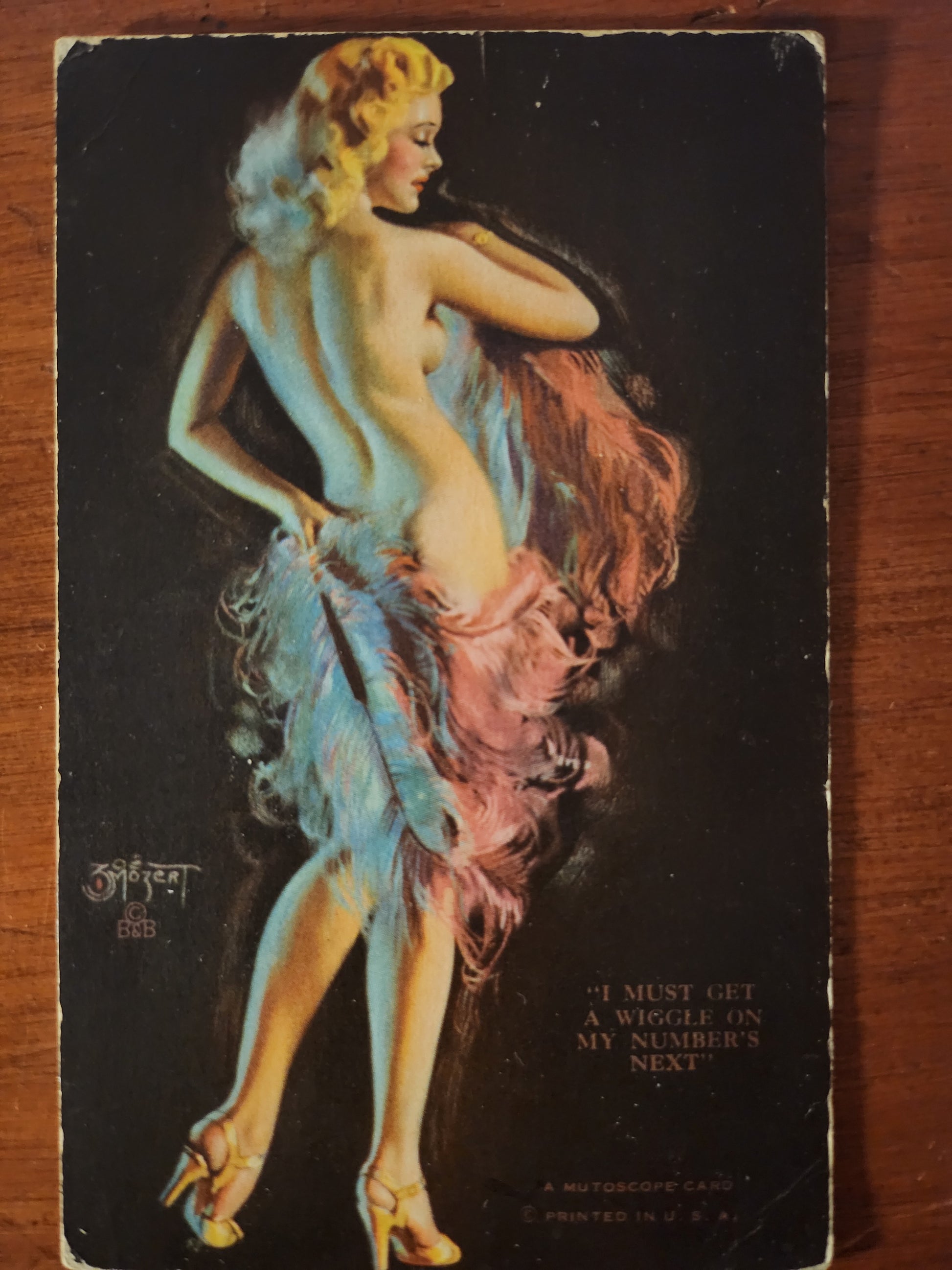 Vintage postcard pin-up model with a stylized illustration of a nude figure on a dark background by Zoe Mozert 