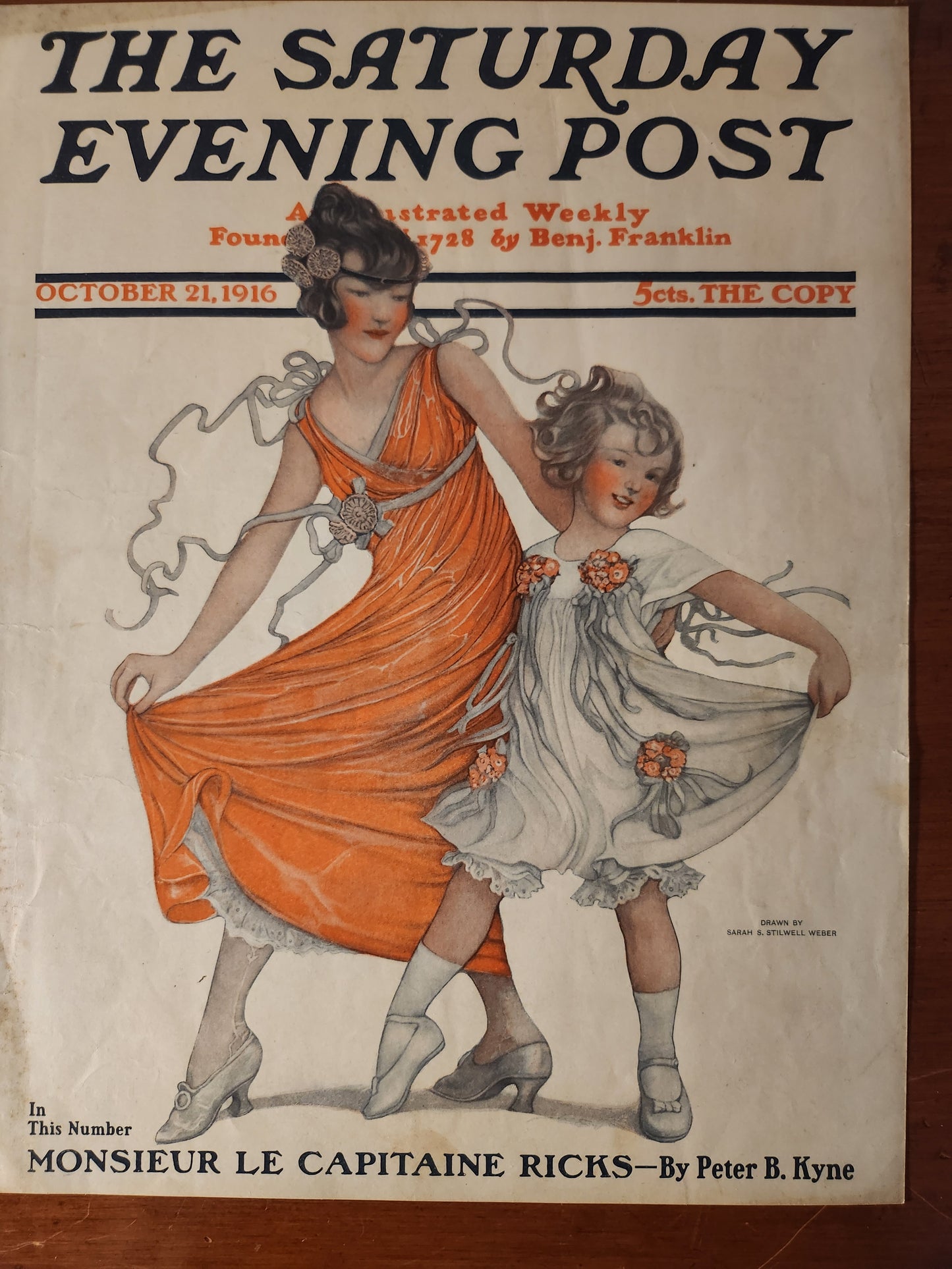 Vintage magazine cover of 'The Saturday Evening Post' with a woman  and a young girl in floral-themed dresses by Sarah S. Stilwell Weber