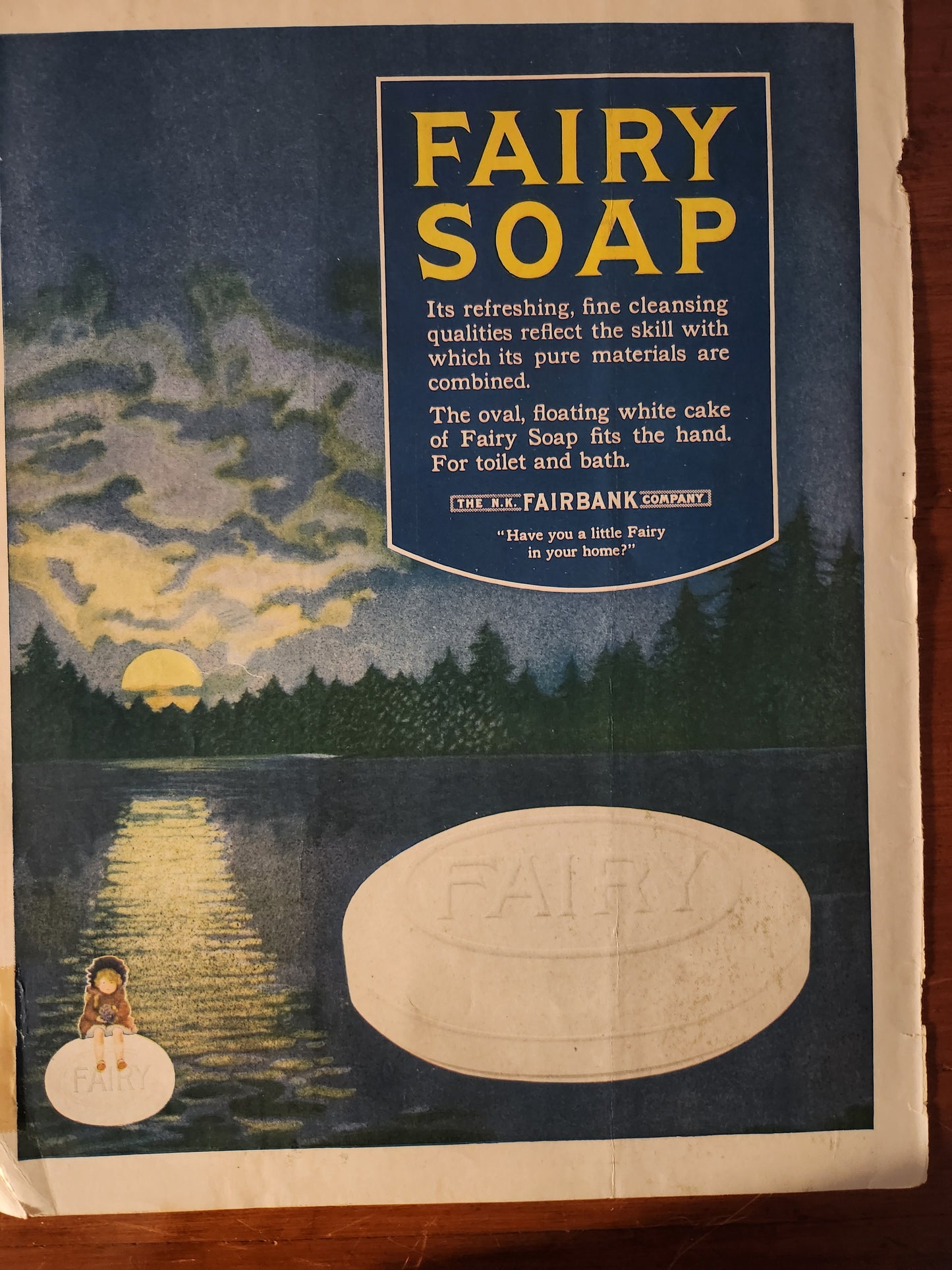 Vintage advertisement for Fairy Soap with blue background and oval logo 