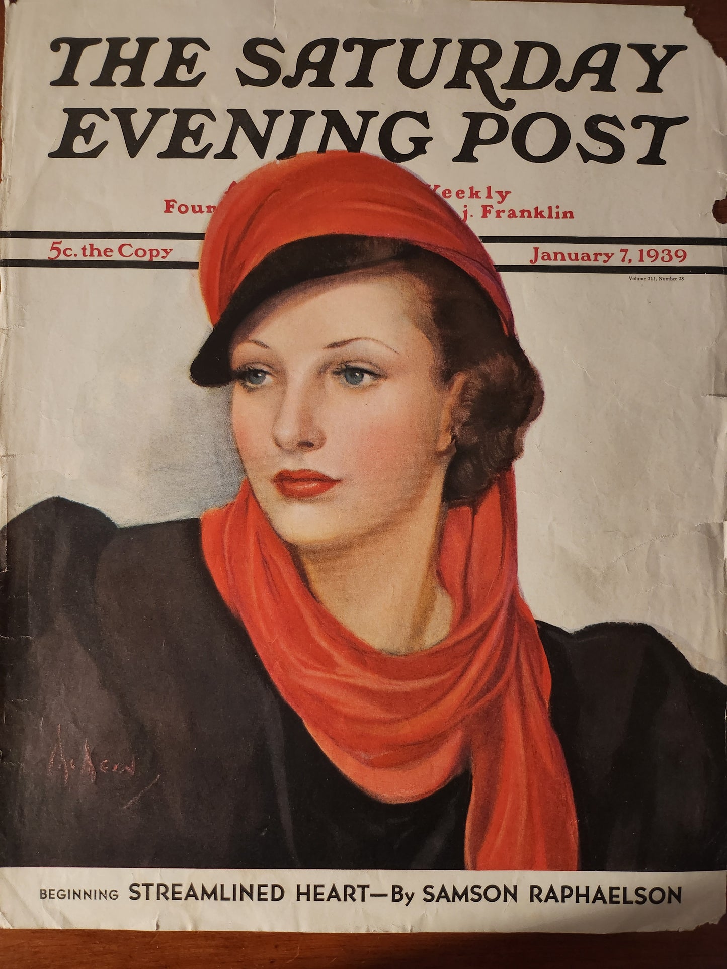 Vintage magazine cover of 'The Saturday Evening Post' with a woman's face on the front by Neysa McMein 