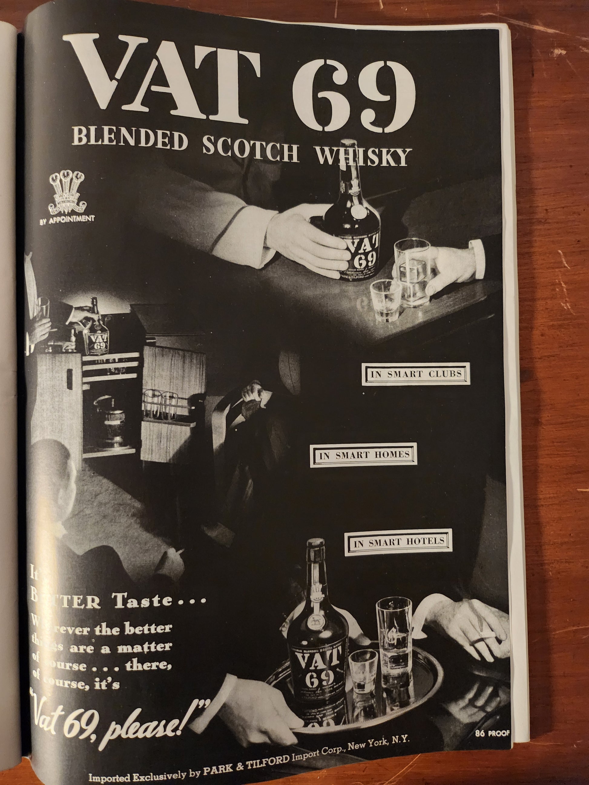 VAT 69 blended Scotch whisky advertisement with black and white imagery of people around a table.