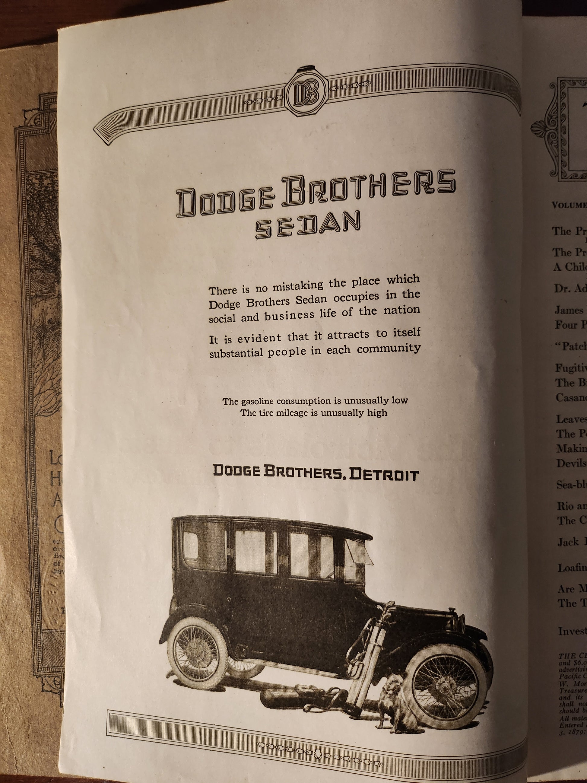 Vintage advertisement for Dodge Brothers Sedan with vehicle illustration on a sepia-toned background